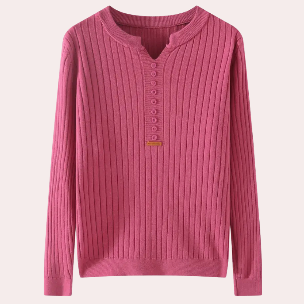 Roze geribbelde damestrui met knoopsluiting, lange mouwen en ronde hals. Perfect voor casual en stijlvolle herfst- en winteroutfits.