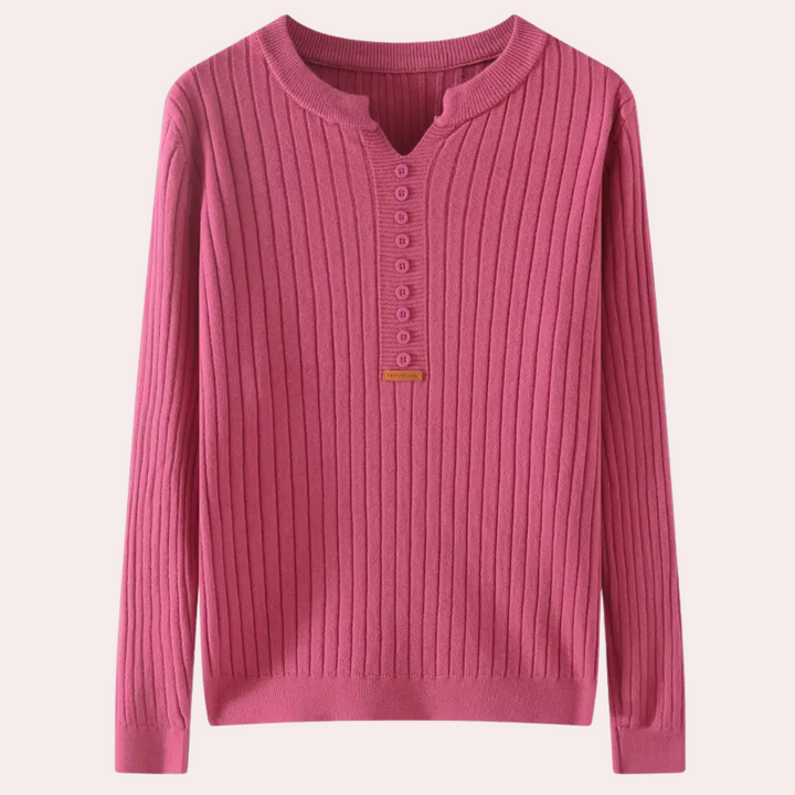 Roze geribbelde damestrui met knoopsluiting, lange mouwen en ronde hals. Perfect voor casual en stijlvolle herfst- en winteroutfits.