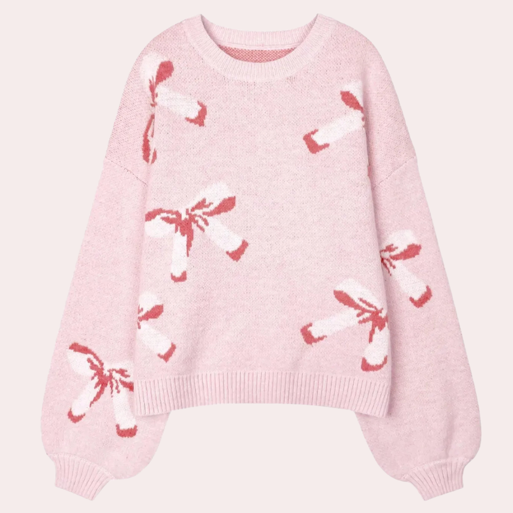Roze damestrui met lange mouwen, versierd met rode strikpatronen. Zachte gebreide stof, ideaal voor casual en modieuze winteroutfits.
