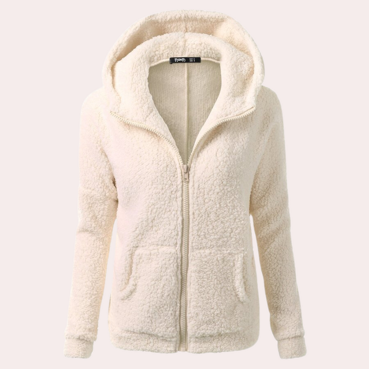 Crèmekleurige fleece dameshoodie met ritssluiting, zachte textuur, capuchon, lange mouwen. Perfect voor casual wintermode en comfort.