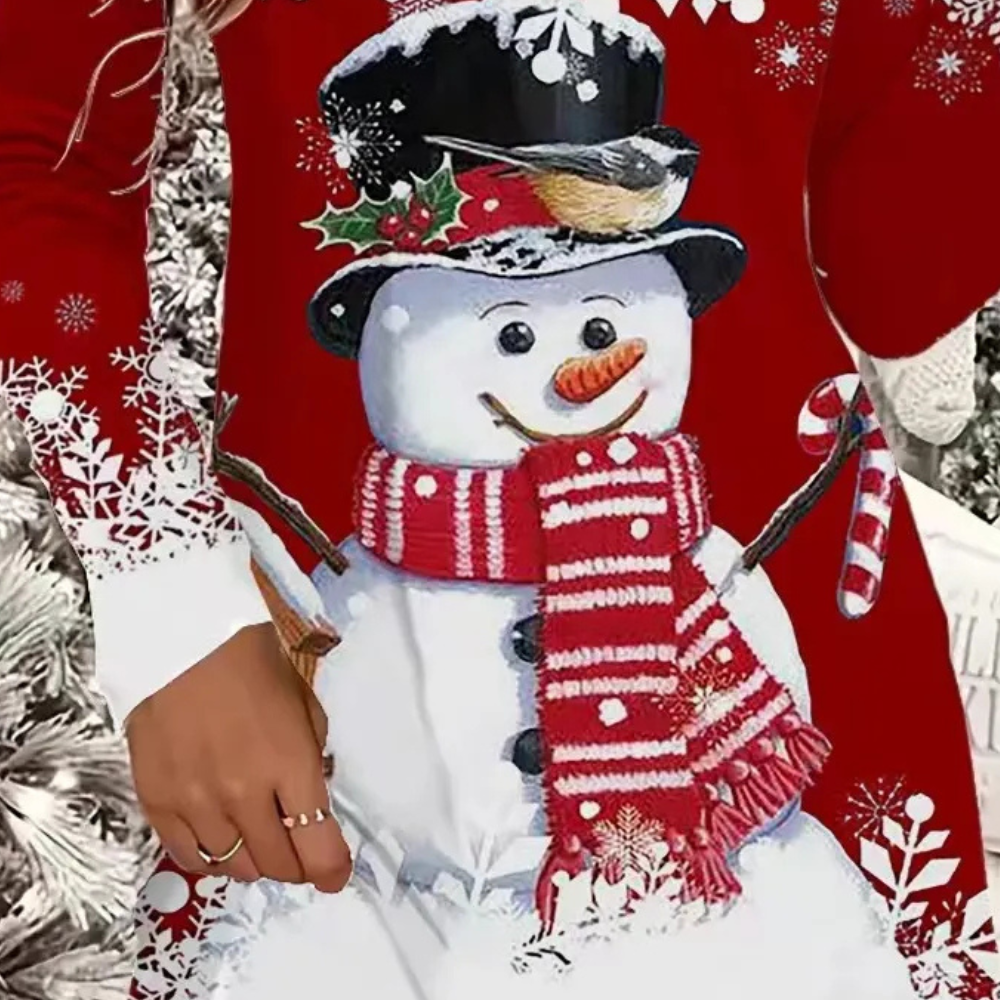 Sneeuwpop op rode kersttrui met hoed, sjaal en snoepstok, versierd met sneeuwvlokken en kerstmotieven. Perfect voor winter- en kerstmode.