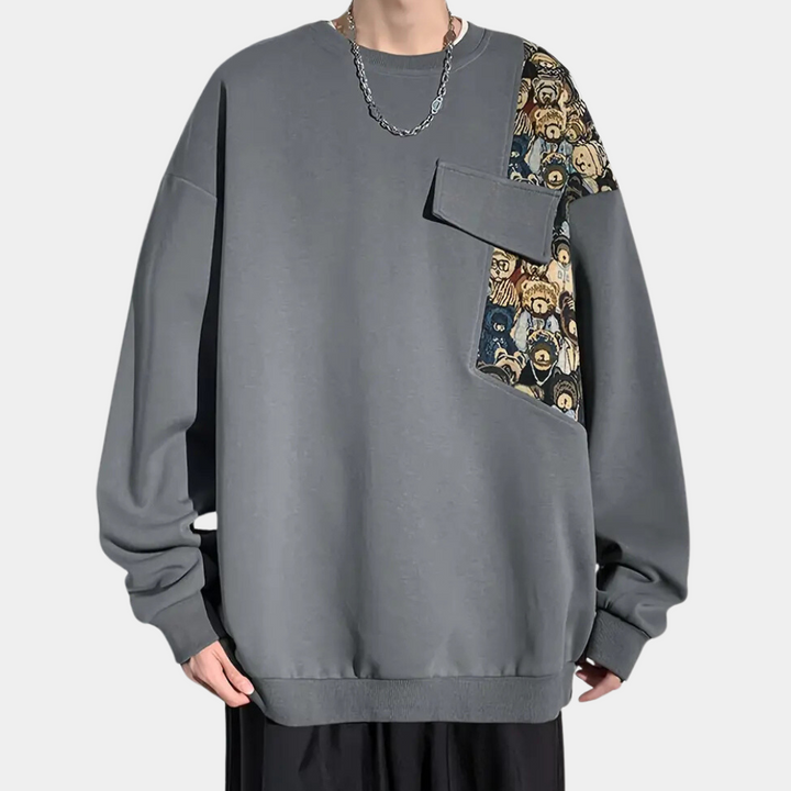 Grijze oversized trui met unieke print en borstzak, unisex streetwear, casual mode, trendy design, comfortabele pasvorm, herenkleding.