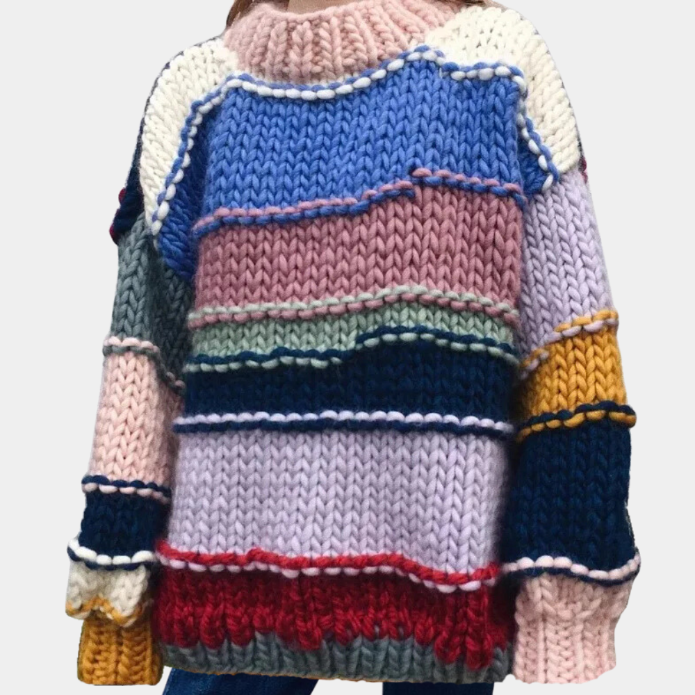 Kleurrijke gebreide trui met strepen in blauw, roze, geel en rood. Handgemaakt, wintermode, warme damestrui, trendy en comfortabel.