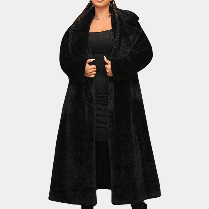 Zwarte lange faux fur jas voor dames, elegant en stijlvol, perfect voor wintermode. Ideaal voor koude dagen en trendy outfits.
