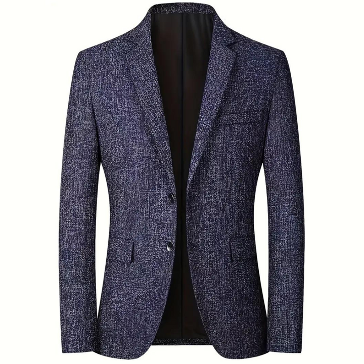 Blauwe herenblazer met textuur, twee knopen en smalle revers. Perfect voor formele gelegenheden. Stijlvolle en moderne pasvorm.
