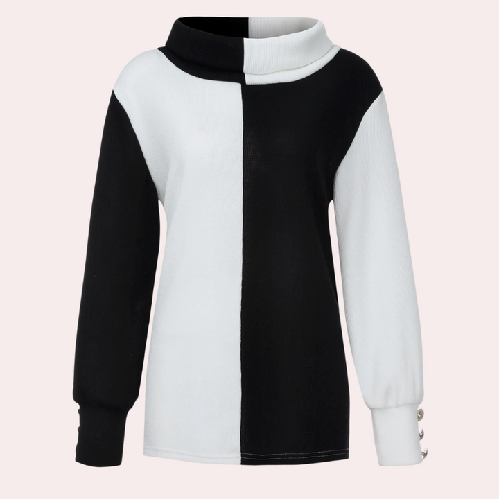 Zwart-witte coltrui met kleurblokdesign, lange mouwen en knoopdetails. Modieuze damestrui, geschikt voor herfst- en wintermode.
