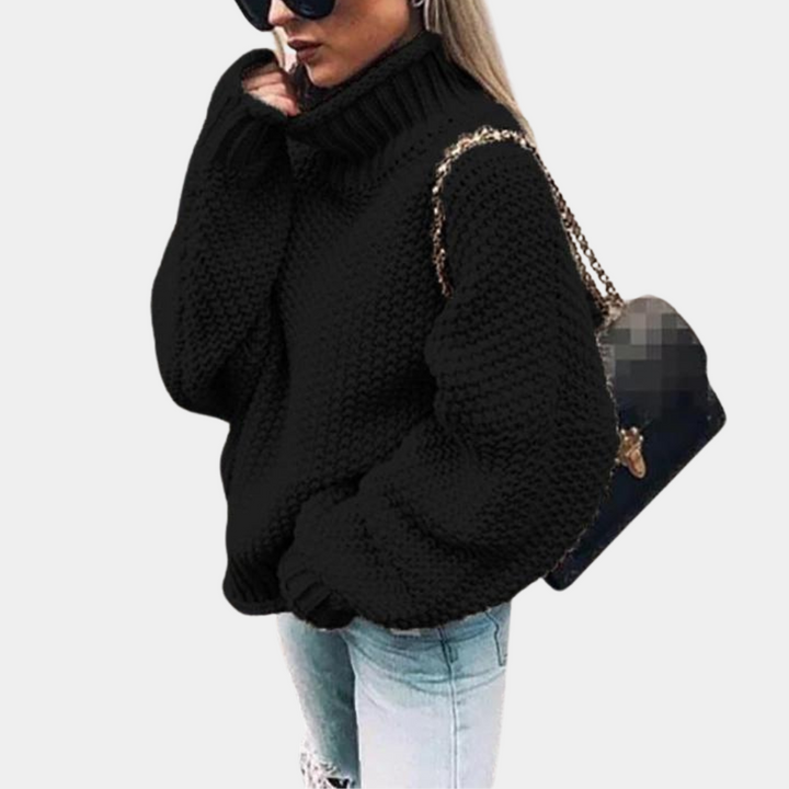 Damestrui zwart gebreid, oversized coltrui, warme wintermode, casual stijl, trendy dameskleding, comfortabele trui voor koude dagen.