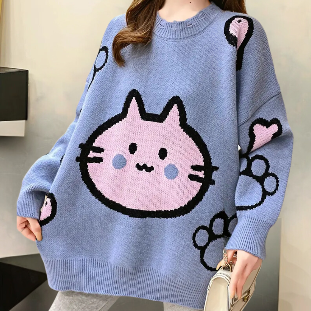 Blauwe oversized trui met schattige roze katprint, ballon- en pootafdrukdetails. Perfect voor casual mode en comfortabele winterkleding.
