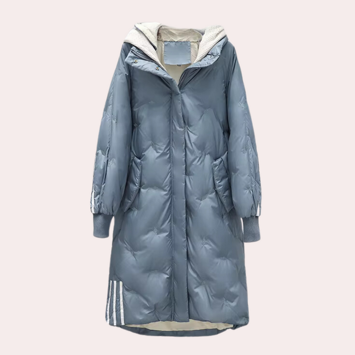 Lange blauwe gewatteerde winterjas met capuchon, damesmode, warme en stijlvolle jas, ideaal voor koude seizoenen, trendy winterkleding.