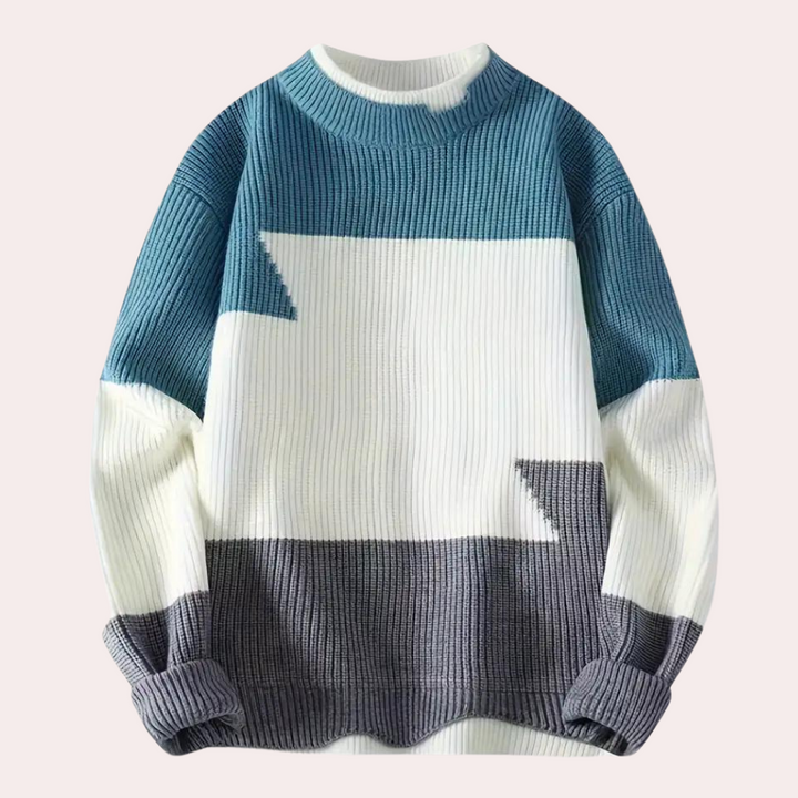 Blauwe en witte gebreide trui met geometrisch patroon, ronde hals en lange mouwen. Modieuze herentrui, winterkleding, casual stijl.