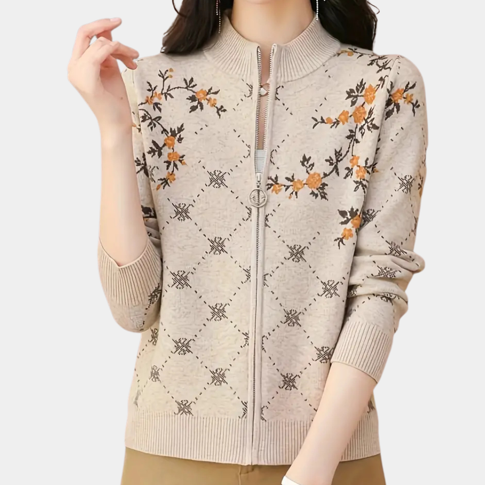 Beige gebreid vest met bloemenpatroon, ritssluiting en lange mouwen. Modieuze dameskleding, herfsttrui, casual stijl, comfortabele pasvorm.
