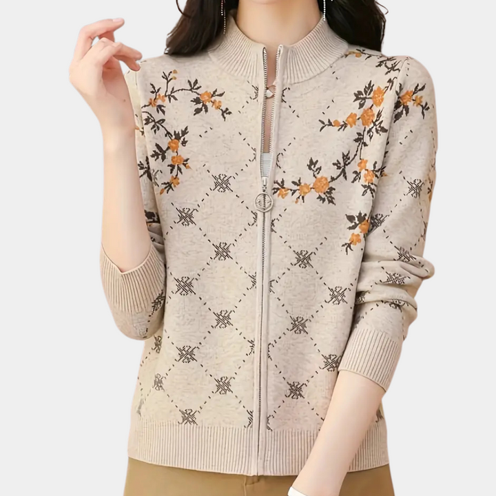 Beige gebreid vest met bloemenpatroon, ritssluiting en lange mouwen. Modieuze dameskleding, herfsttrui, casual stijl, comfortabele pasvorm.