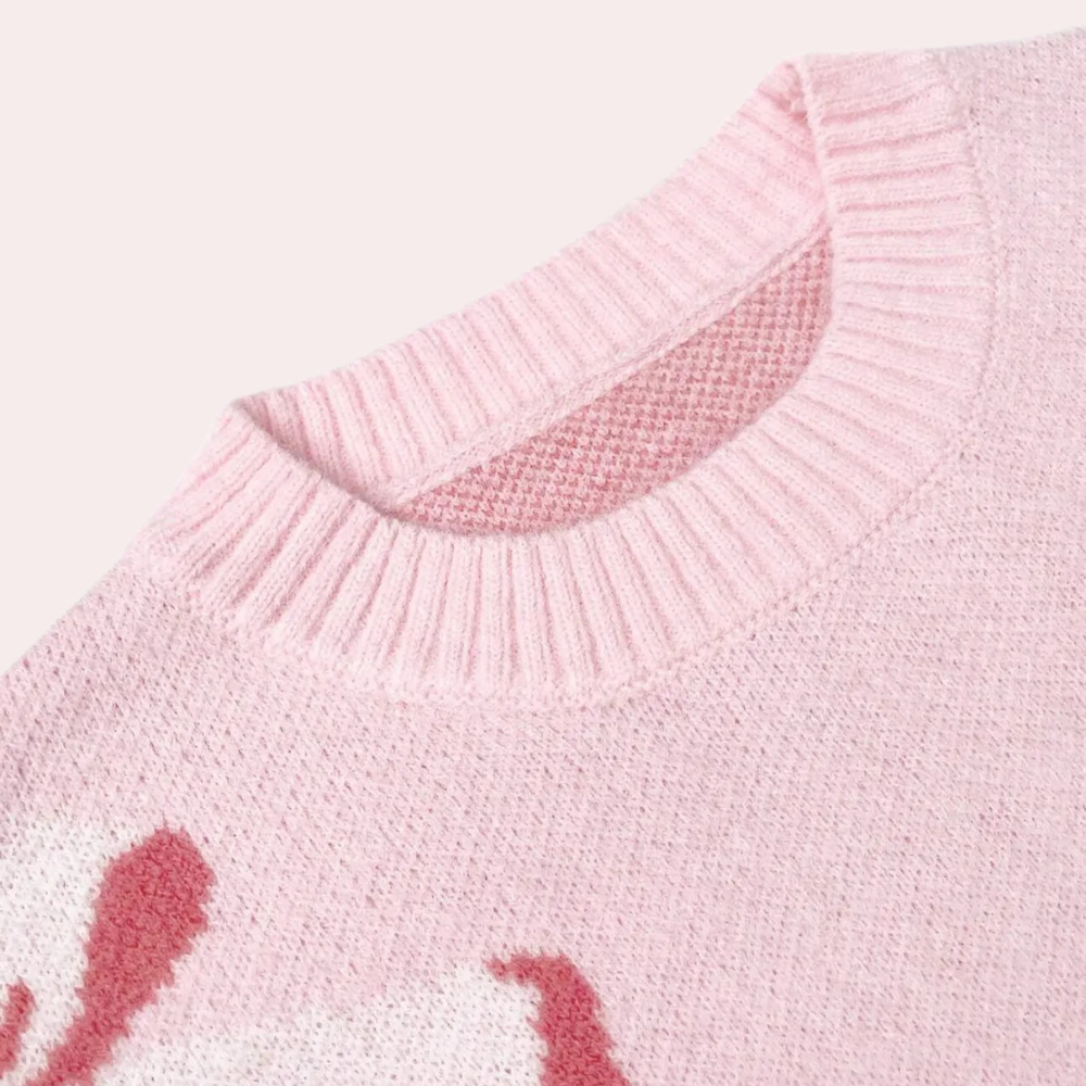 Roze gebreide trui met ronde hals en witte bloemenprint, zachte stof, modieuze dameskleding, ideaal voor herfst- en winterseizoenen.
