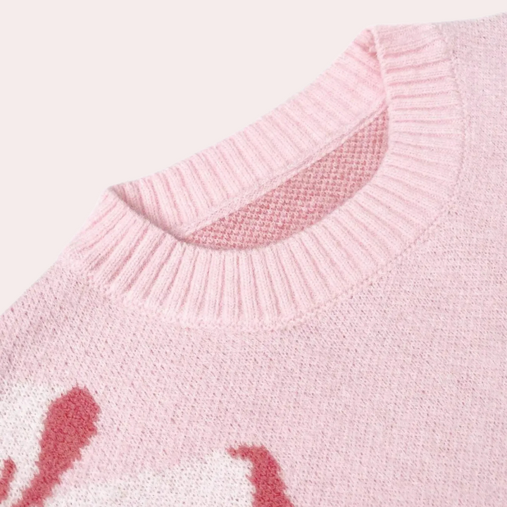 Roze gebreide trui met ronde hals en witte bloemenprint, zachte stof, modieuze dameskleding, ideaal voor herfst- en winterseizoenen.