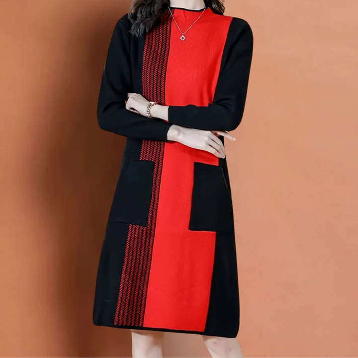 Vrouw in elegante zwart-rode jurk met lange mouwen en geometrisch patroon, modieuze kleding, herfst-winter mode, stijlvolle damesjurk.