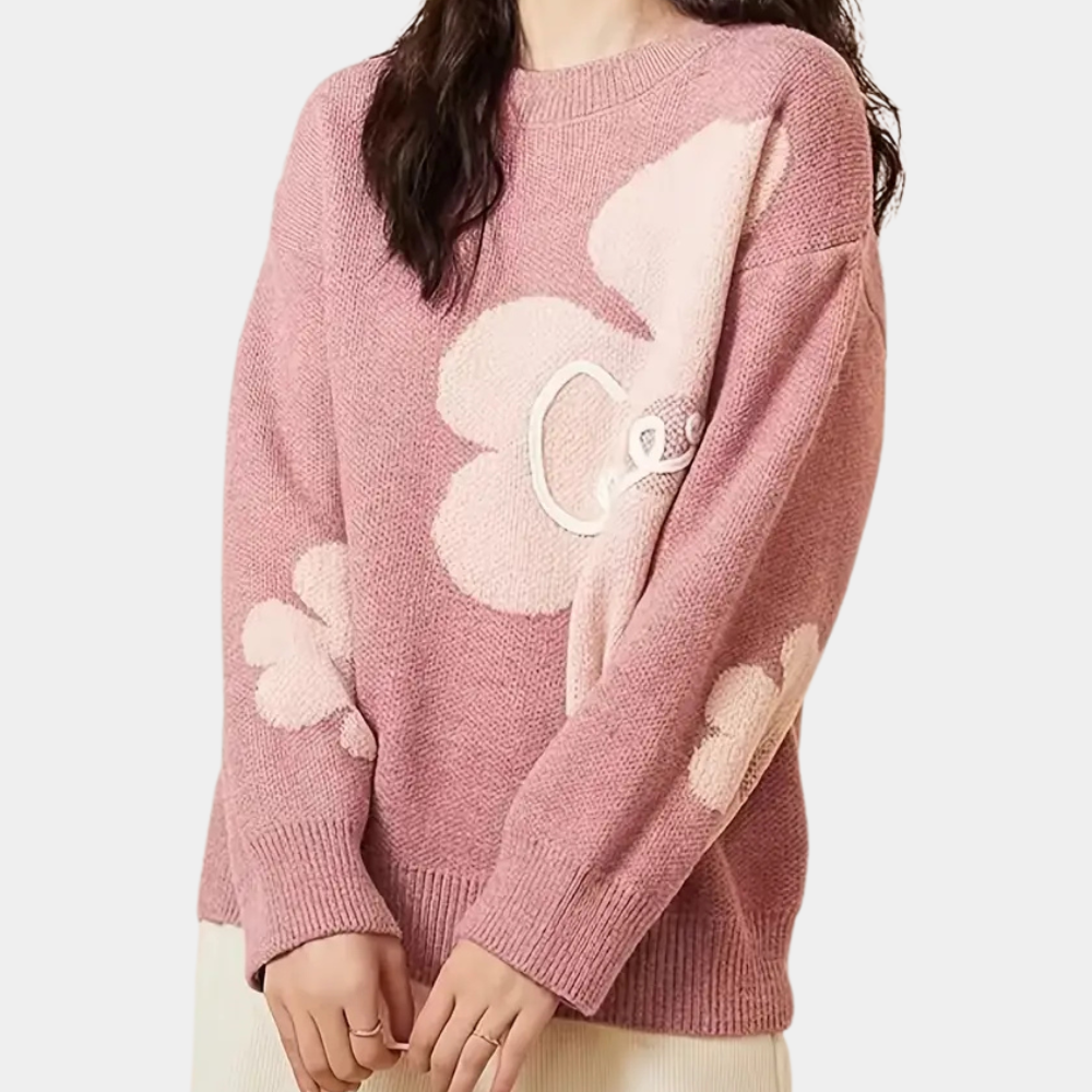 Roze damestrui met bloemmotief, lange mouwen en ronde hals. Zachte stof, casual stijl. Perfect voor herfst- en wintermode.
