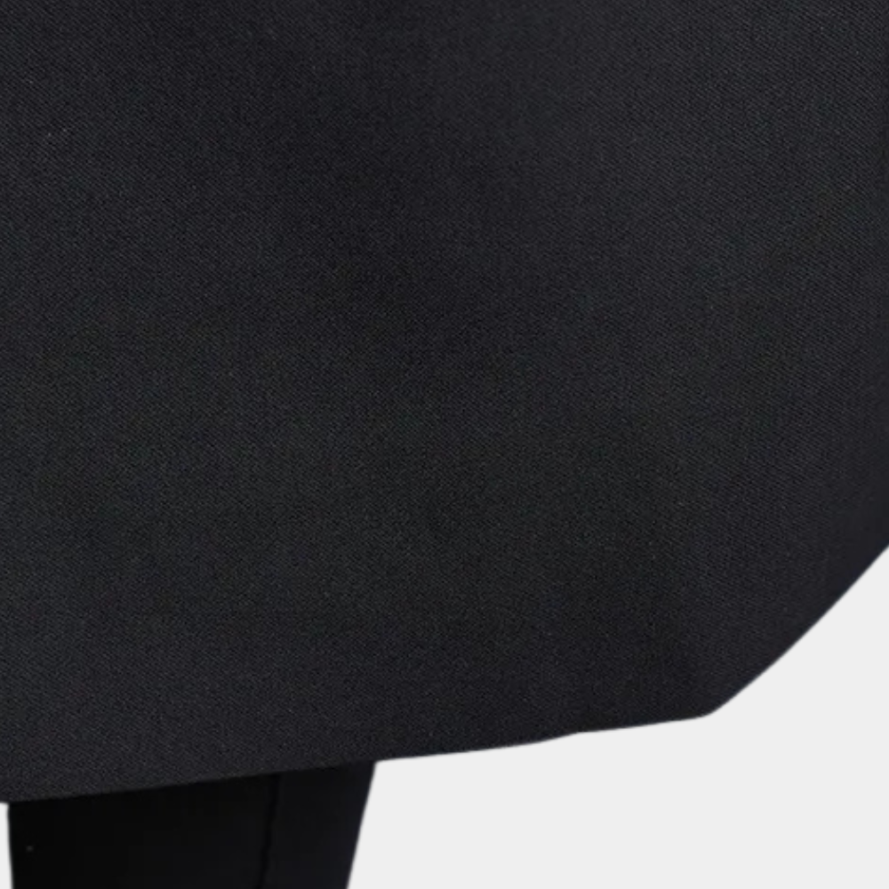 Zwarte stoffen rok, close-up textuur, minimalistisch ontwerp, modieuze dameskleding, elegant en veelzijdig voor dagelijks gebruik en speciale gelegenheden.