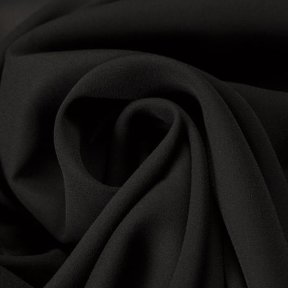 Zwarte stof close-up, zachte textuur, geschikt voor kleding en interieur. Hoogwaardige textielmaterialen, elegant en veelzijdig gebruik.
