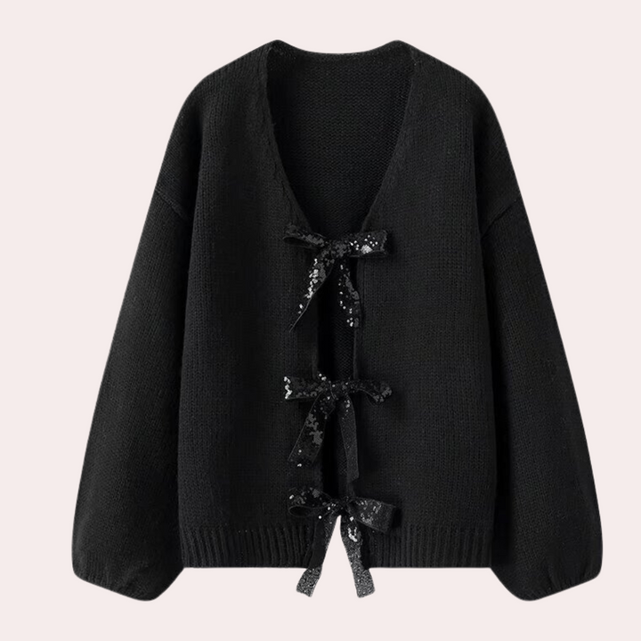 Zwarte gebreide damestrui met V-hals en strikdetails, lange mouwen, modieuze herfstkleding, comfortabele en stijlvolle trui voor dagelijks gebruik.