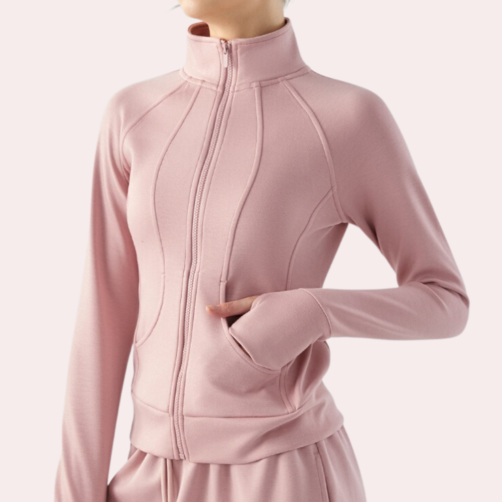 Roze dames sportvest met ritssluiting, hoge kraag en zakken. Perfect voor yoga en fitness. Comfortabele en stijlvolle sportkleding.