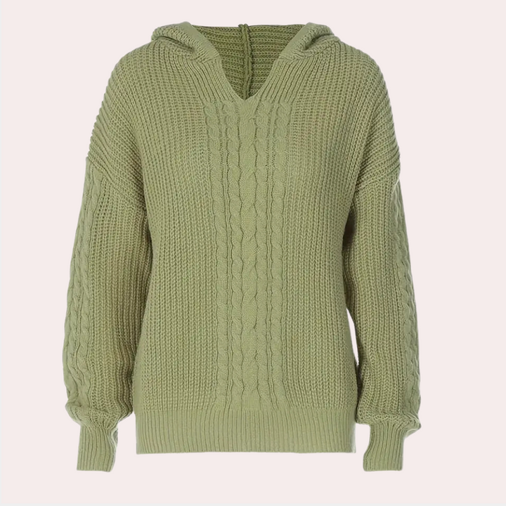 Groene gebreide damestrui met capuchon, kabelpatroon en lange mouwen. Perfect voor herfstmode en casual winteroutfits.