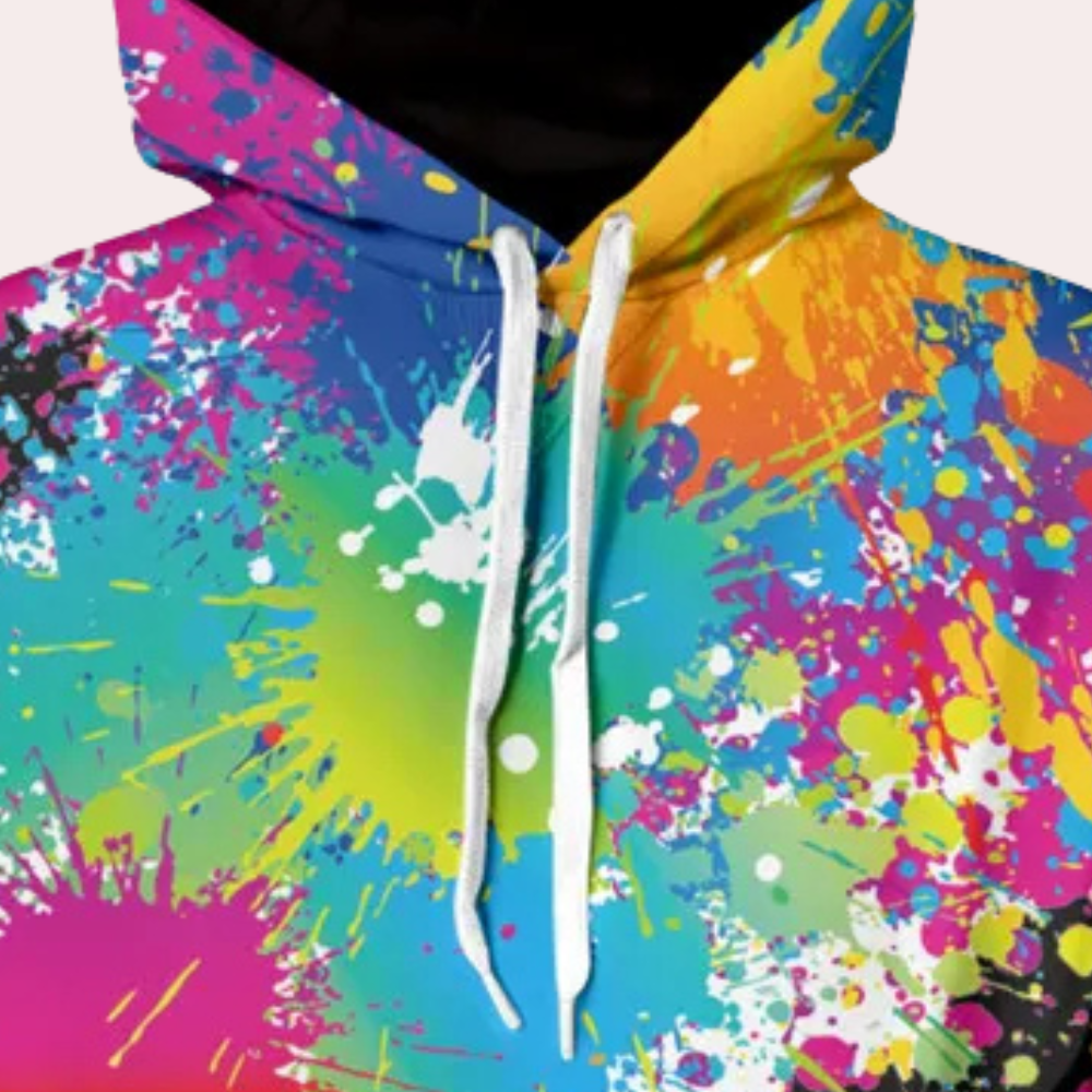 Kleurrijke hoodie met abstracte verfspatten in blauw, groen, geel en roze. Trendy streetwear, unisex mode, opvallend design.