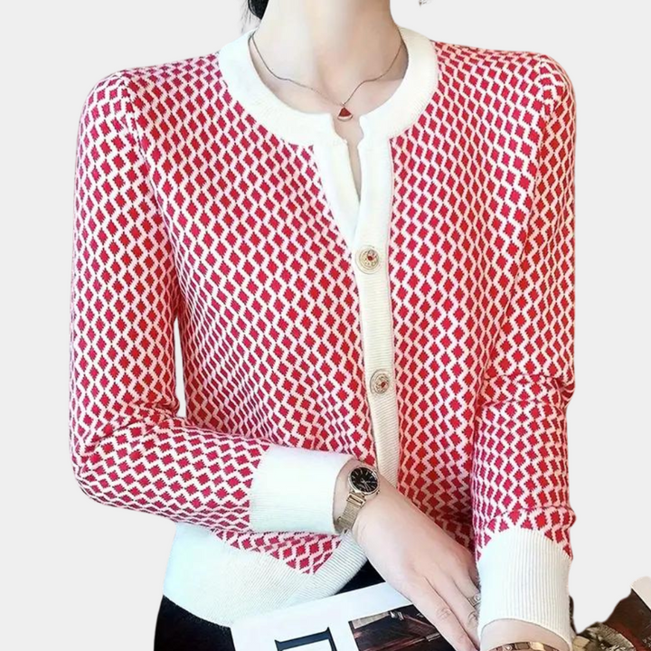 Damestrui met rood-wit geometrisch patroon, ronde hals en knoopsluiting. Modieuze dameskleding, perfect voor casual en chique outfits.