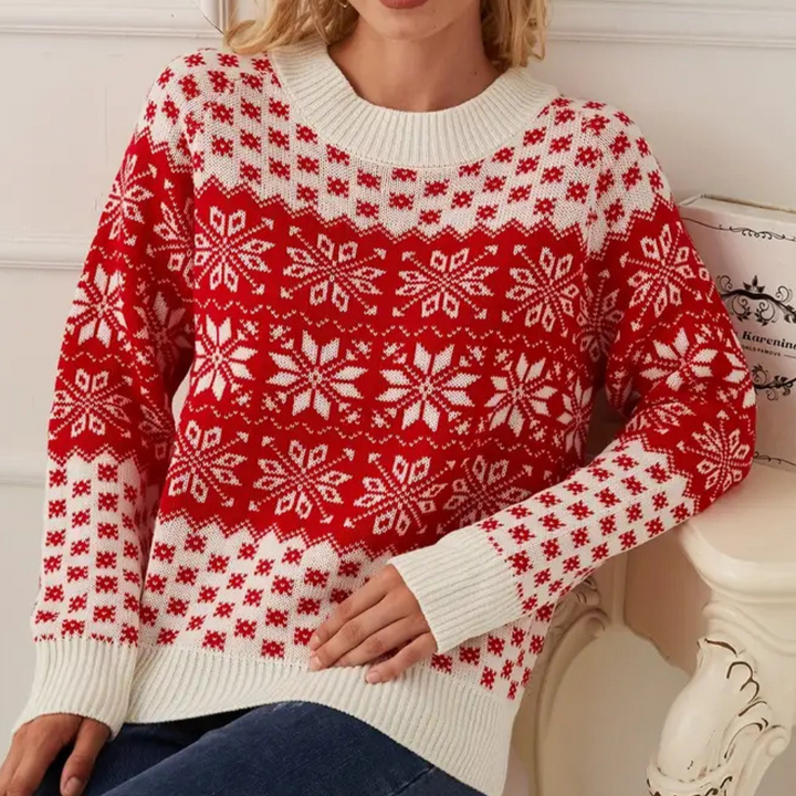 Rode en witte kersttrui met sneeuwvlokpatroon, gebreid design, ronde hals, lange mouwen. Perfect voor feestdagen en wintermode.