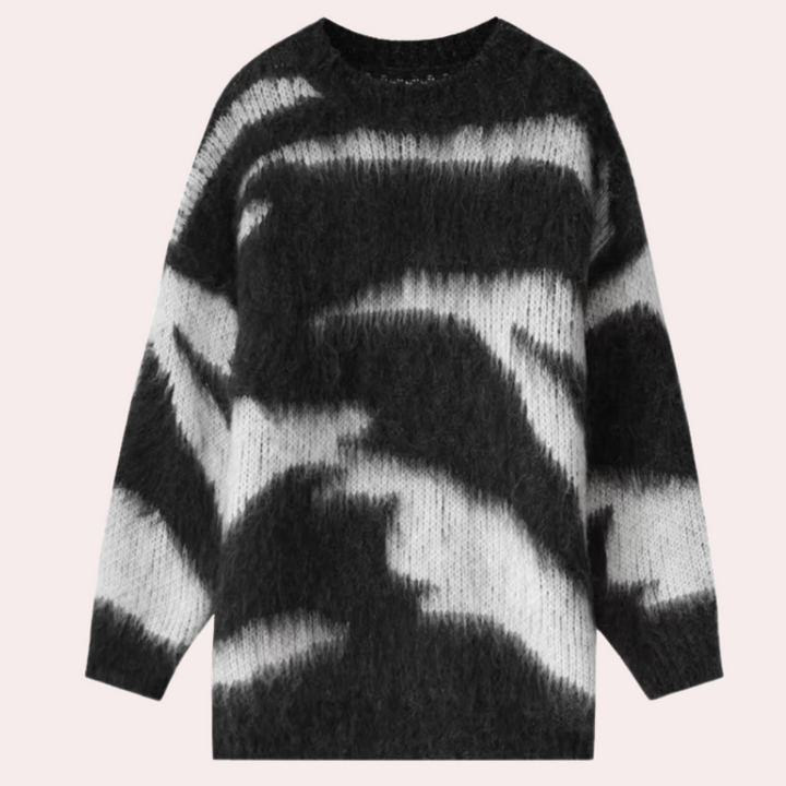 Zwart-witte gebreide trui met abstracte print, lange mouwen en ronde hals. Modieuze damestrui, warme winterkleding, trendy design.