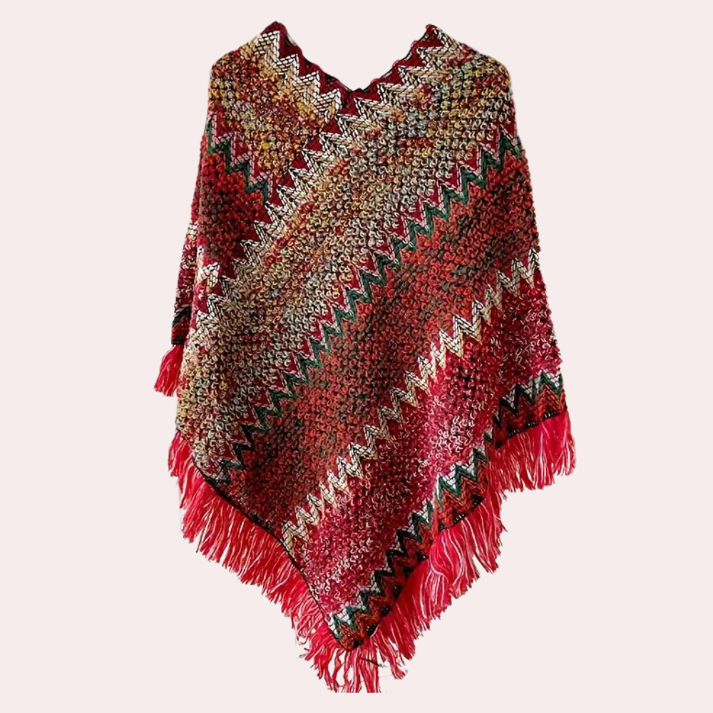 Rode gebreide poncho met kleurrijk zigzagpatroon en franjes, handgemaakt, warme wintermode, bohemian stijl, dameskledingaccessoire.