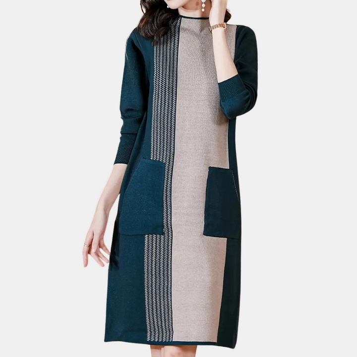 Vrouw in stijlvolle, tweekleurige jurk met lange mouwen en zakken, ideaal voor herfstmode. Elegante dameskleding, casual en chic ontwerp.