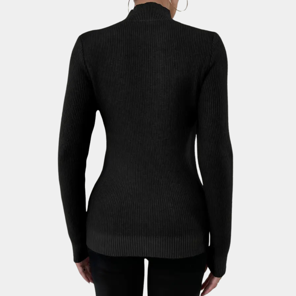 Zwarte ribgebreide damestrui met lange mouwen, getailleerd ontwerp, gezien van achteren. Perfect voor herfst- en wintermode.