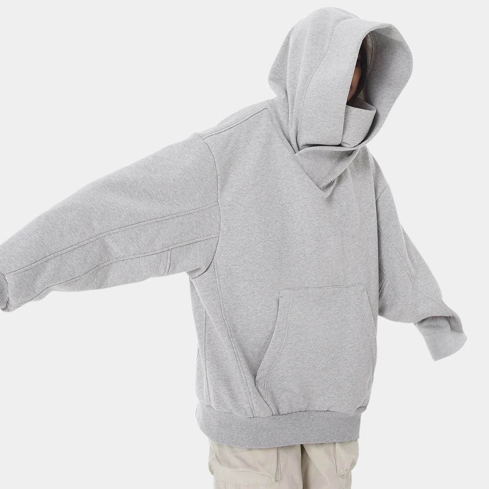 Grijze oversized hoodie met capuchon, uniseks design, comfortabele pasvorm, ideaal voor casual streetwear. Gemaakt van zacht katoen.