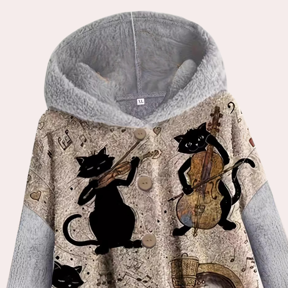 Grijze hoodie met kattenprint, muzieknoten en instrumenten, gemaakt van fleece. Perfect voor muziekliefhebbers en kattenfans. Comfortabele winterkleding.