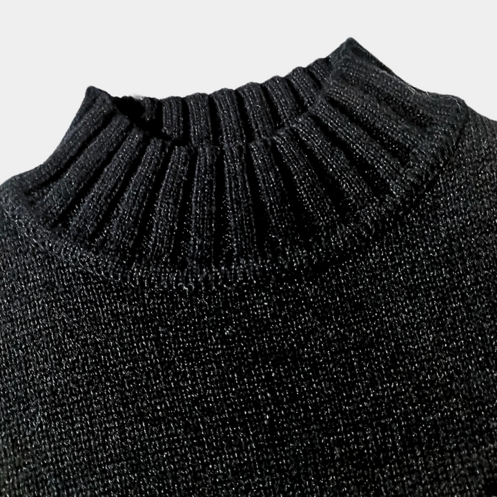 Zwarte gebreide coltrui met geribbelde kraag, warme wintermode, stijlvolle herenkleding, hoogwaardige wolmix, comfortabele pasvorm.