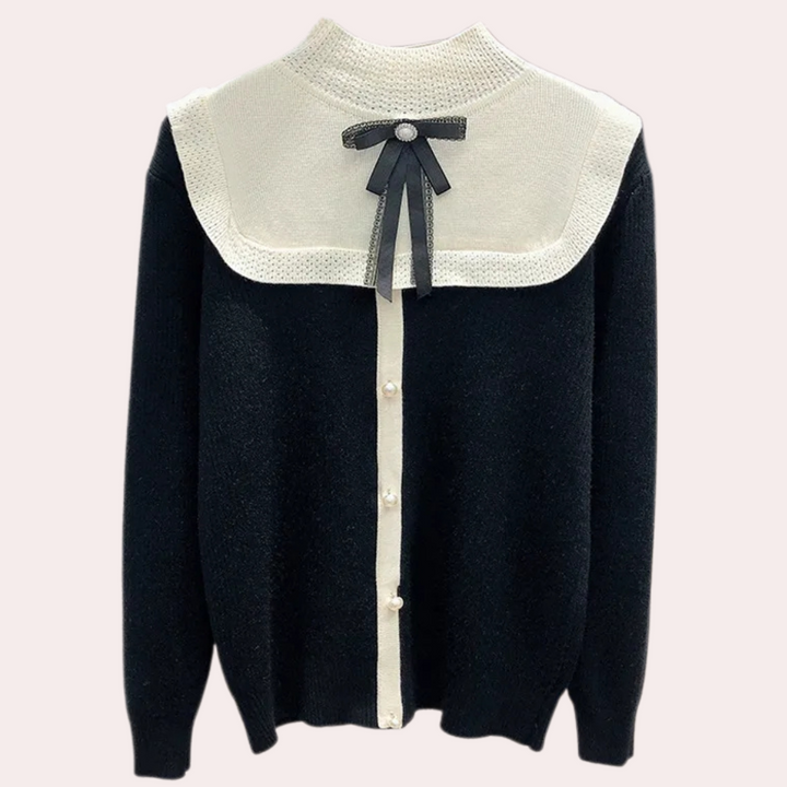 Zwarte damestrui met witte kraag, knoopsluiting en decoratieve strik. Elegante en stijlvolle kleding voor herfst- en wintermode.