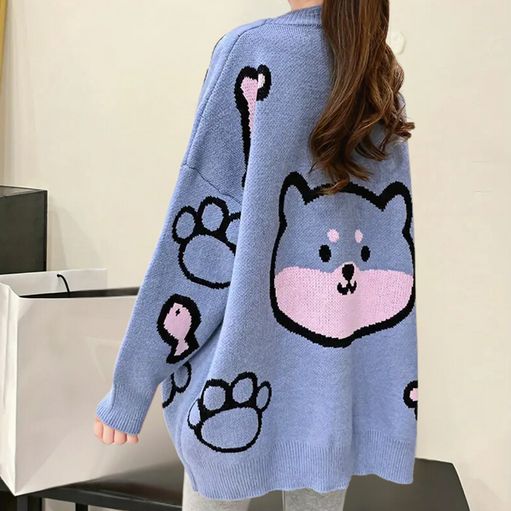 Blauwe oversized trui met schattige cartoon hond en pootafdrukken, trendy damesmode, casual winterkleding, comfortabele gebreide stof.