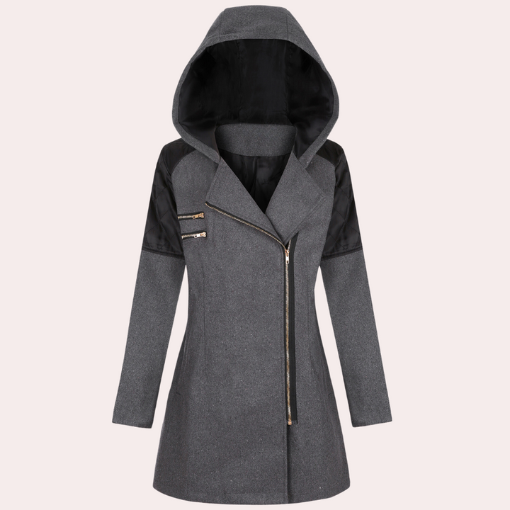 Grijze damesjas met capuchon, asymmetrische ritssluiting en zwarte accenten. Modieuze winterjas, ideaal voor casual en chique gelegenheden.