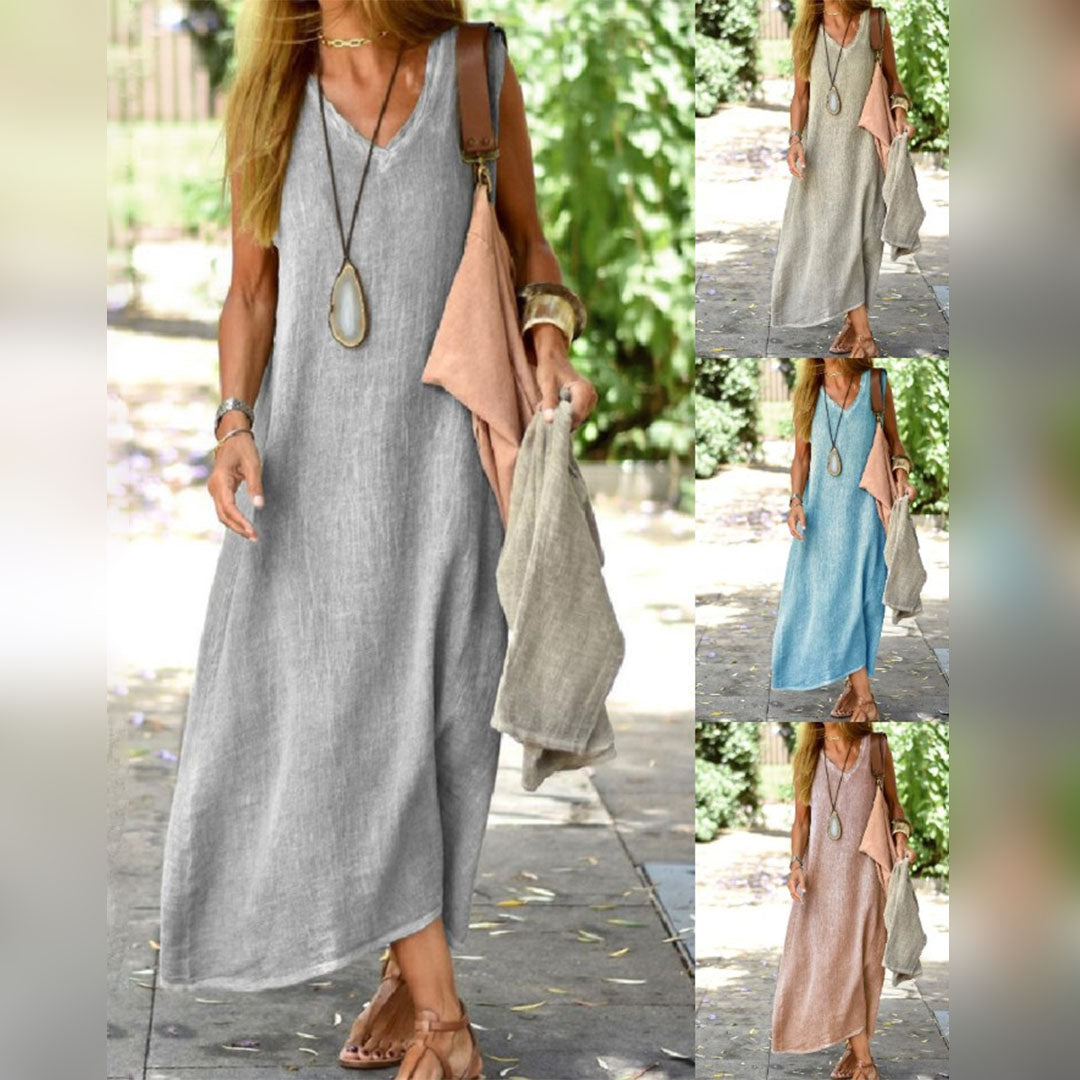 Vrouw in lange linnen zomerjurk met V-hals, verkrijgbaar in grijs, blauw, beige en roze. Ideaal voor casual en strandkleding. Comfortabel en stijlvol.