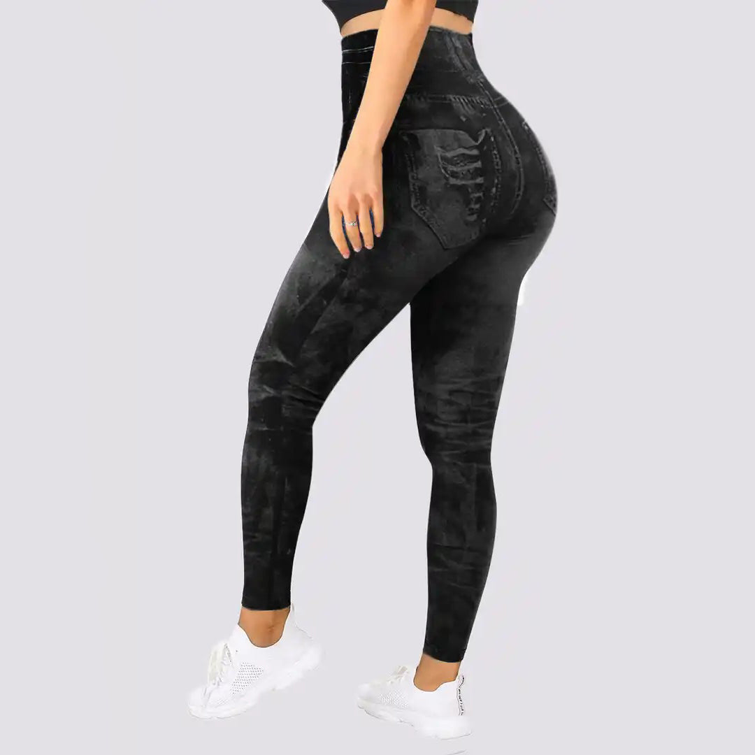 Zwarte hoge taille jegging voor dames, denim look, comfortabele stretchstof, ideaal voor casual en sportieve outfits.