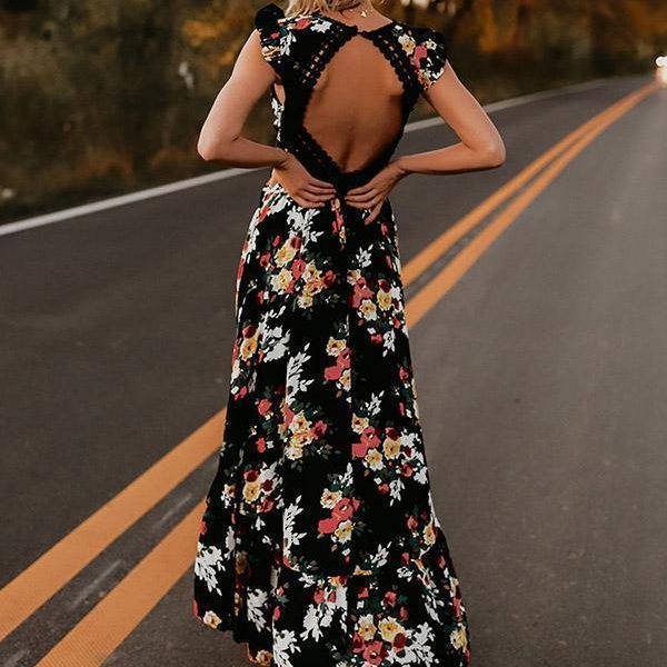 Zwarte bloemenjurk met open rug, elegante avondjurk, damesmode, zomerjurk, bohemian stijl, kleurrijke bloemenprint, trendy kleding.