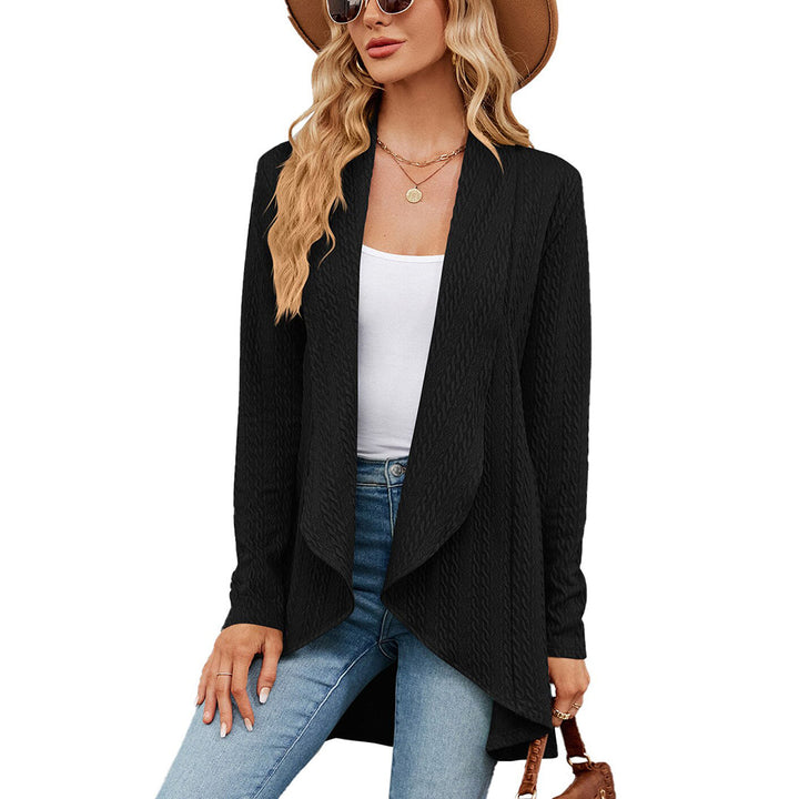 Zwarte damesvest, open voorkant, lange mouwen, casual stijl, perfect voor herfstmode. Combineer met jeans en hoed voor een trendy look.