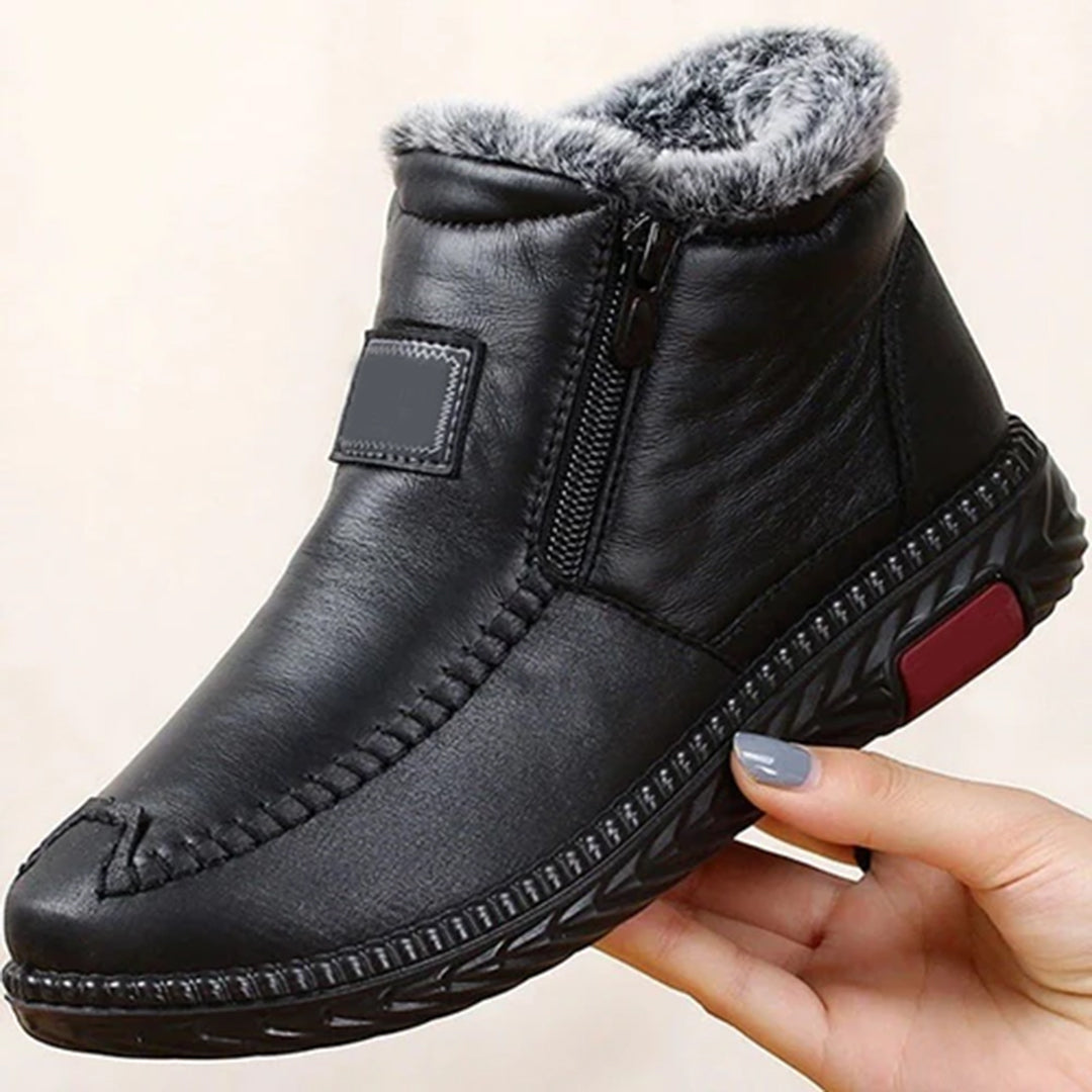 Zwarte winterlaars met bontvoering, ritssluiting en antislipzool. Comfortabele en warme herenlaars, ideaal voor koude weersomstandigheden.