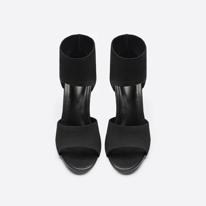 Zwarte dameshakken met open teen en enkelband, elegant design, perfect voor avondkleding en formele gelegenheden. Stijlvolle zwarte sandalen.