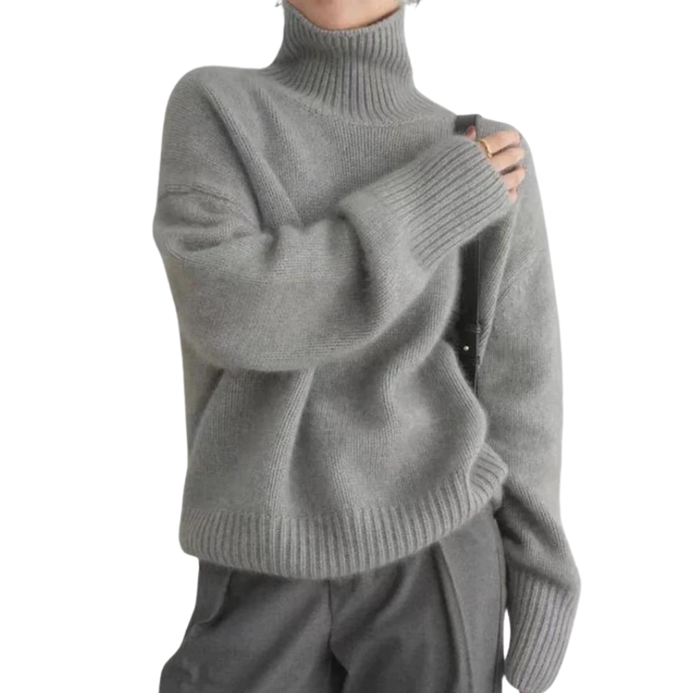 Grijze coltrui dames, zachte gebreide stof, casual wintermode, comfortabele pasvorm, trendy kleding, warme trui, stijlvolle outfit.