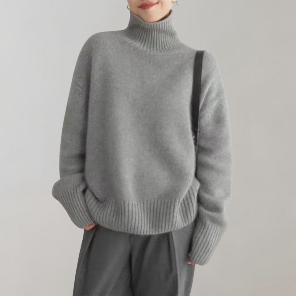 Grijze coltrui dames, zachte stof, casual wintermode, lange mouwen, comfortabele pasvorm, trendy kleding, stijlvolle outfit, modieuze trui.