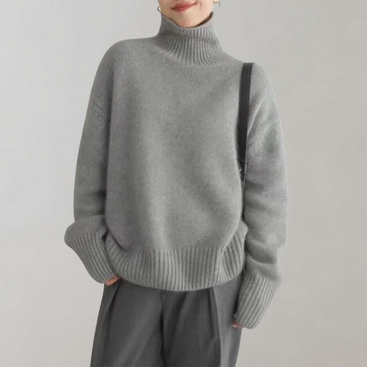 Grijze coltrui dames, zachte stof, casual wintermode, lange mouwen, comfortabele pasvorm, trendy kleding, stijlvolle outfit, modieuze trui.
