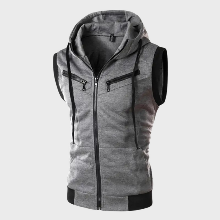 Grijze mouwloze hoodie met capuchon, ritssluiting en borstzakken. Stijlvolle herenkleding, ideaal voor casual en sportieve outfits.