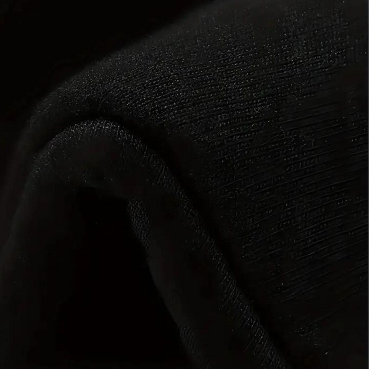 Zwarte stof close-up, textuur zichtbaar, geschikt voor kleding en interieur. Hoogwaardige kwaliteit, duurzaam en veelzijdig gebruik.