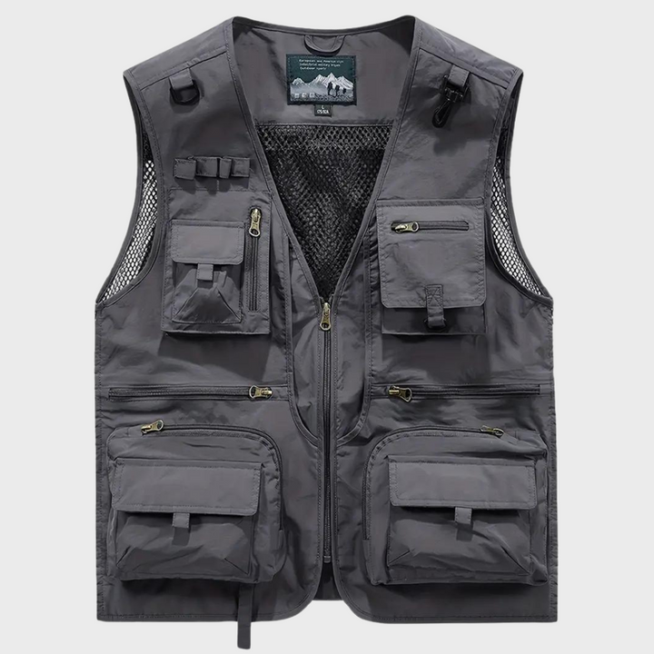 Grijze multifunctionele outdoor vest met meerdere zakken, ideaal voor vissen, wandelen en kamperen. Duurzaam materiaal, praktische ritsen.